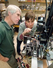 Scientists Rob Olson and Heidi Sosik work on the FlowCytobot automated submersible plankton sensor.